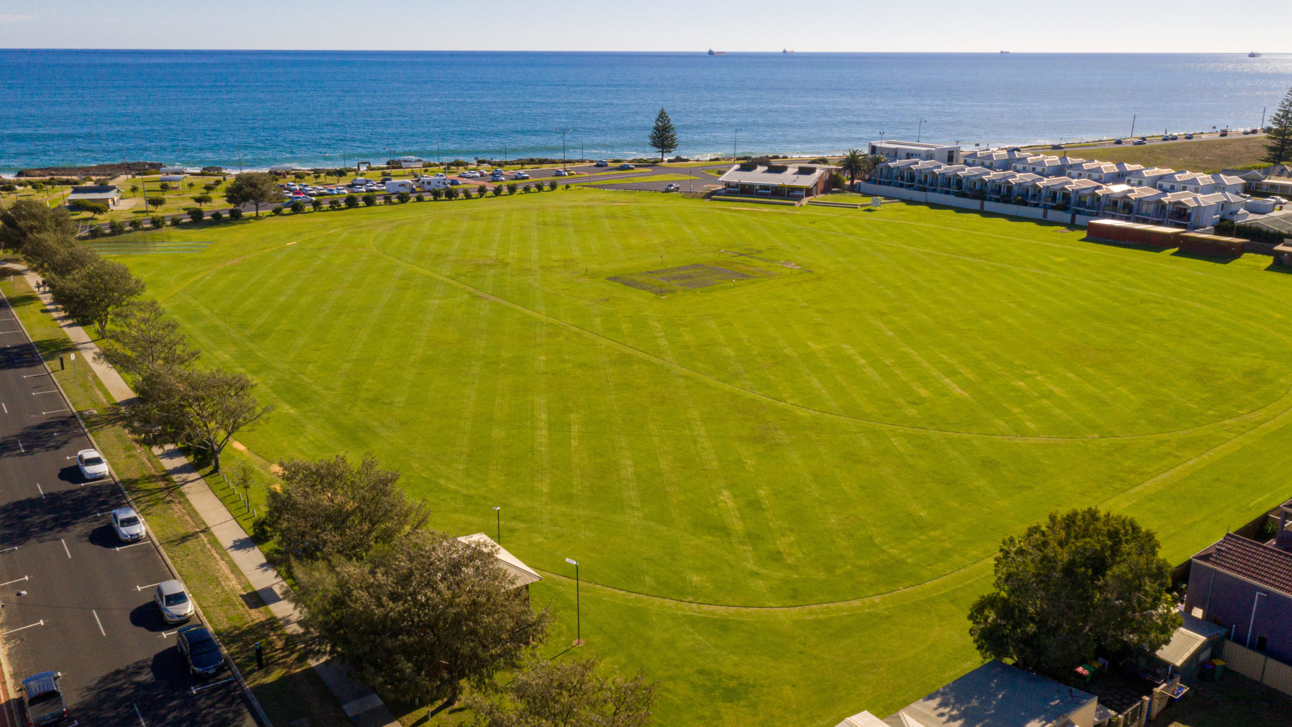 Aerial view of Bunbury Recreation Ground large green oval with ocean in the background