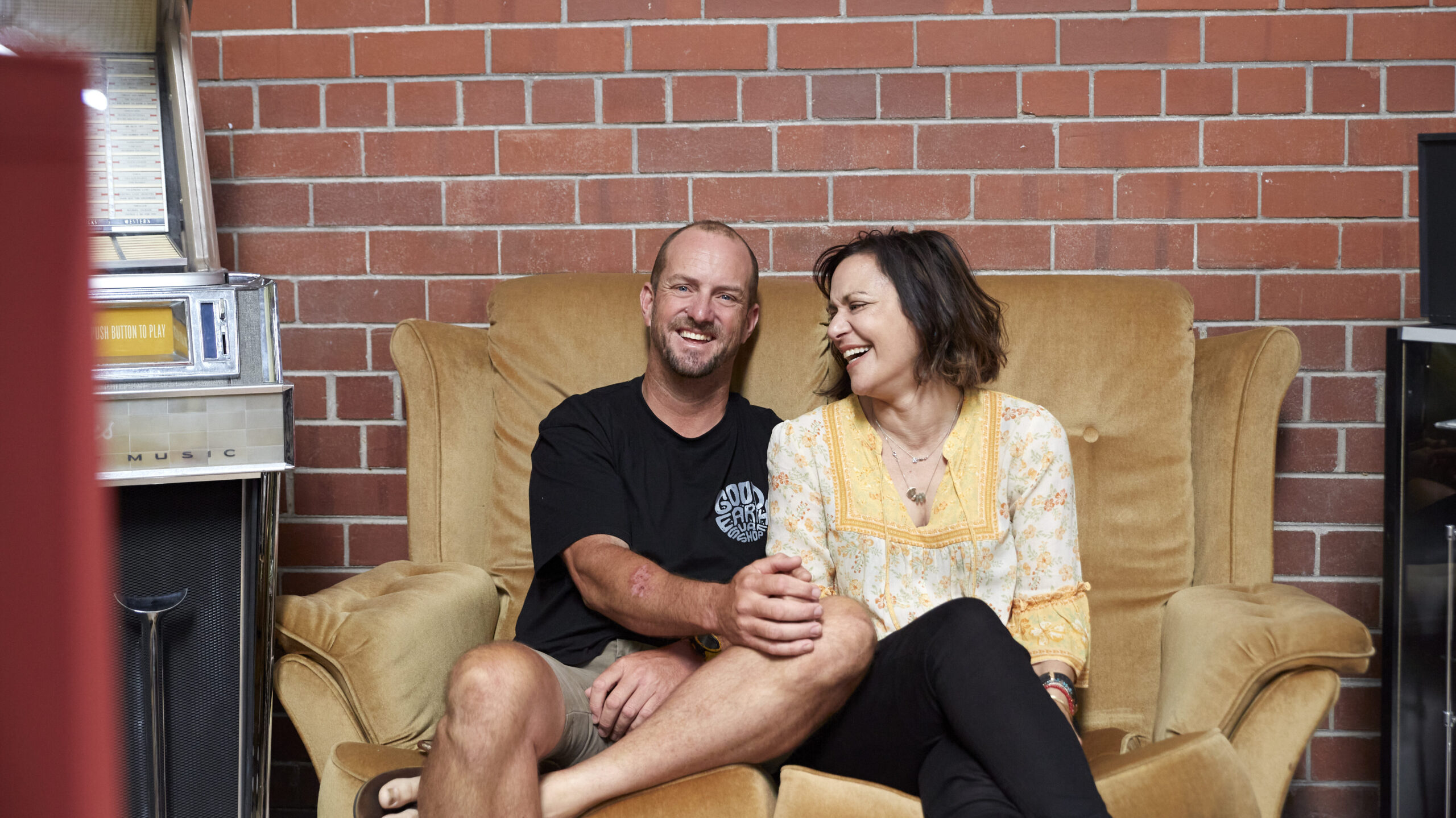 Darren and Zena Hotker on the couch at their business.